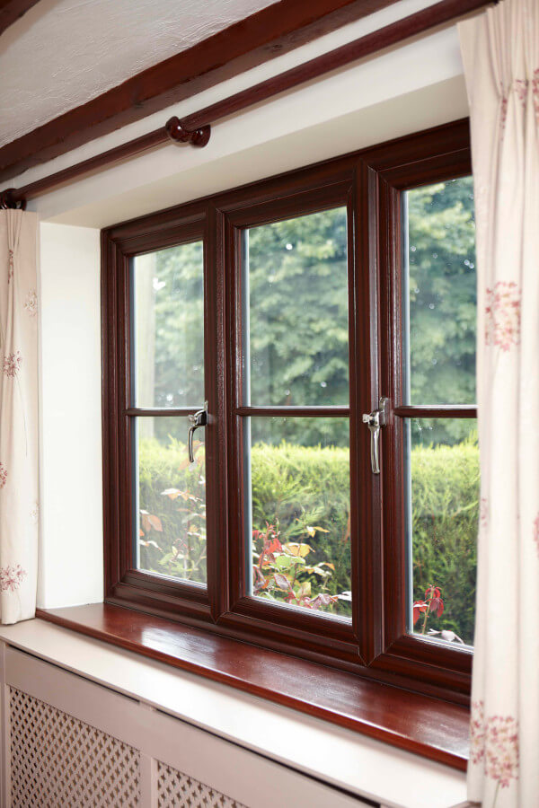 Interior view of REHAU upVC rosewood wood effect casement windows