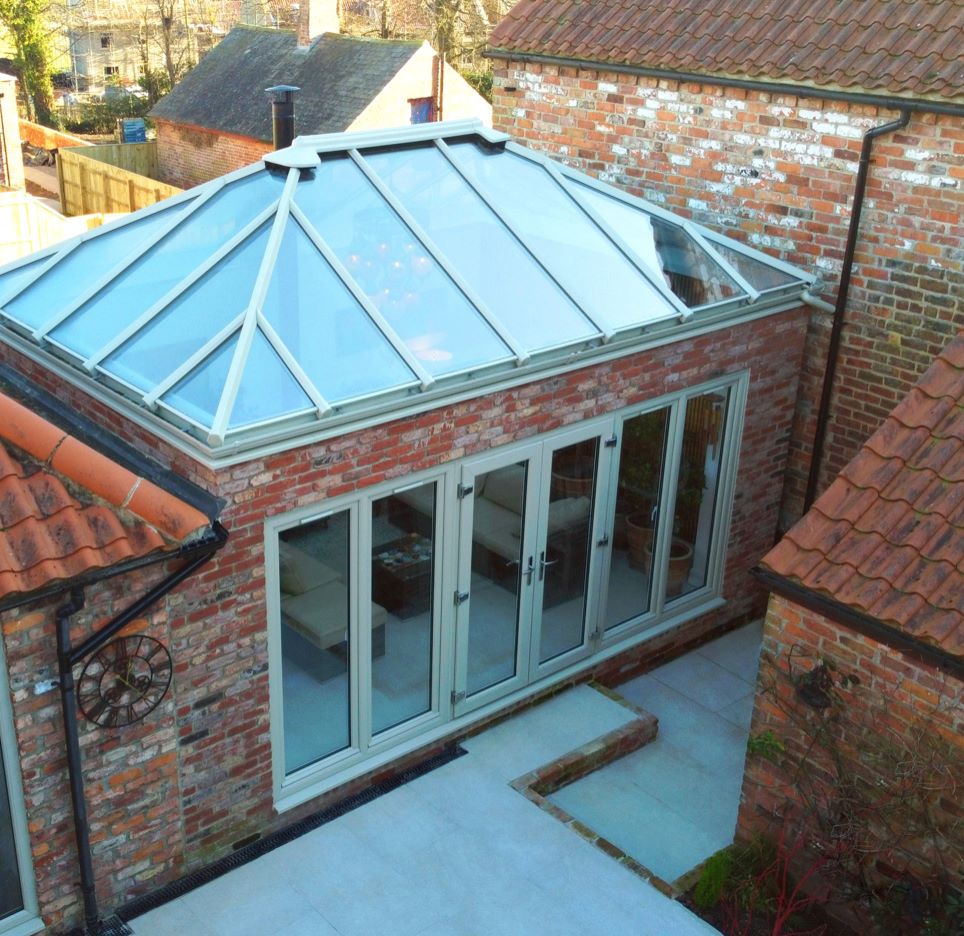 heightened view of glass roof conservatory with french doors