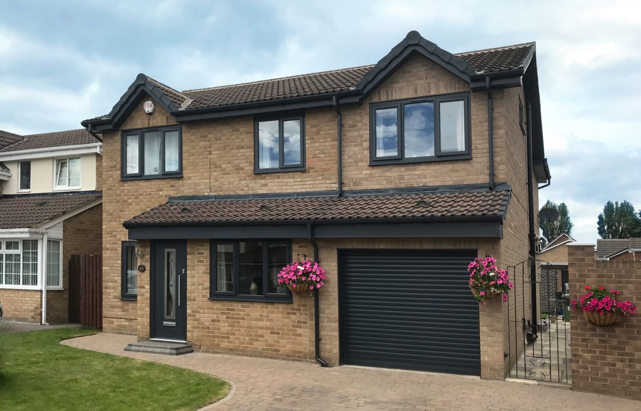 the facade of a house featuring a newly-installed front door