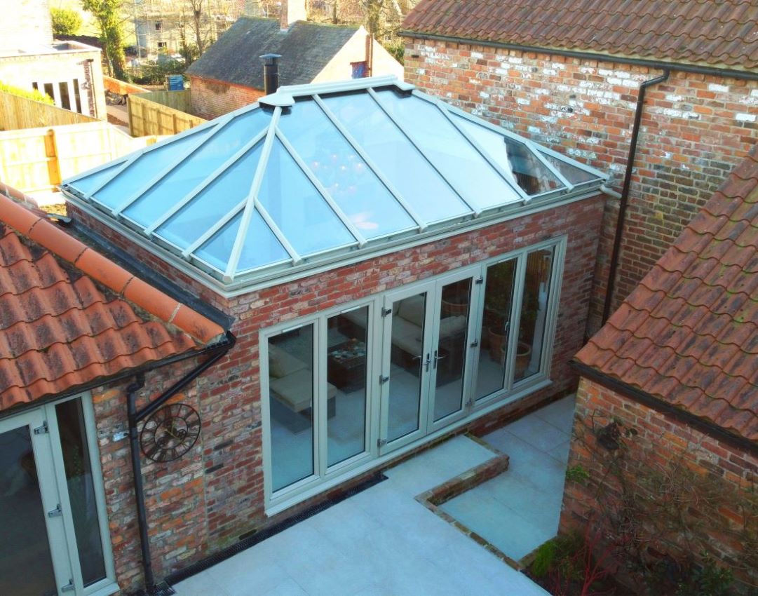 glass roof orangery with chartwell green upvc french doors